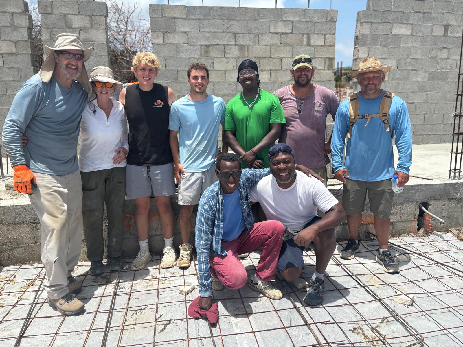 The team on the rising walls of Crossroad Community Church