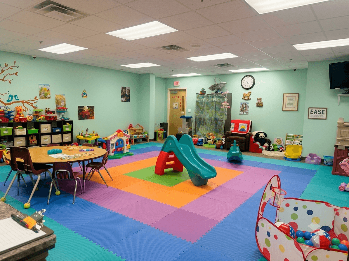 Bright, colorful nursery play space with soft mats and toys